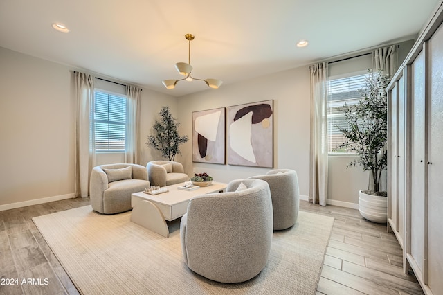 living room featuring hardwood / wood-style floors and a chandelier