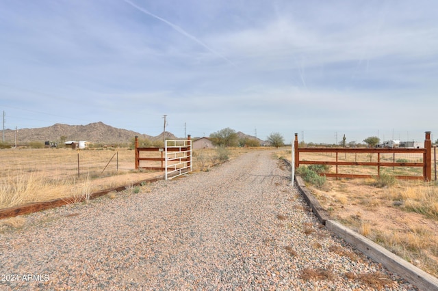 view of street with a mountain view and a rural view