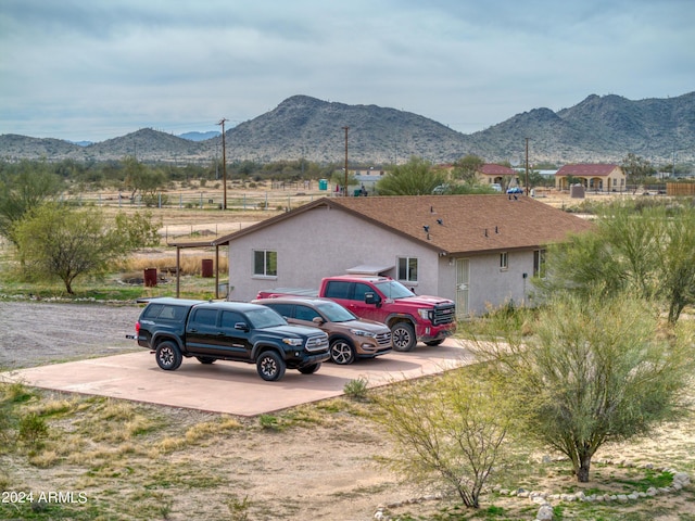 view of car parking with a mountain view