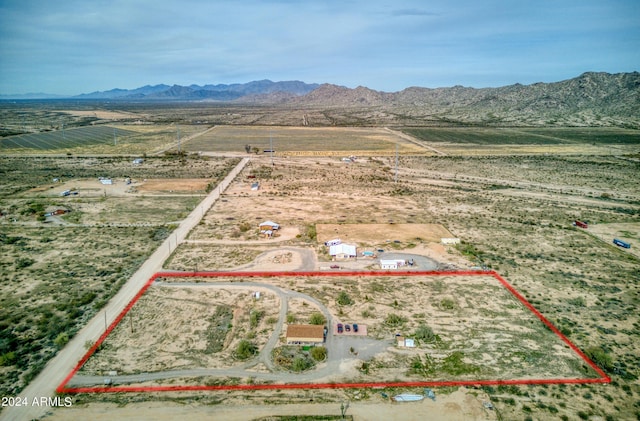 drone / aerial view with a mountain view and a rural view