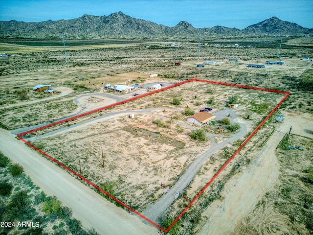 birds eye view of property featuring a mountain view