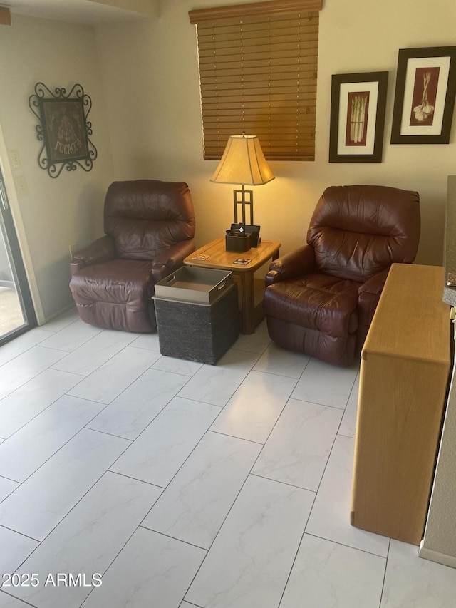 living room featuring marble finish floor