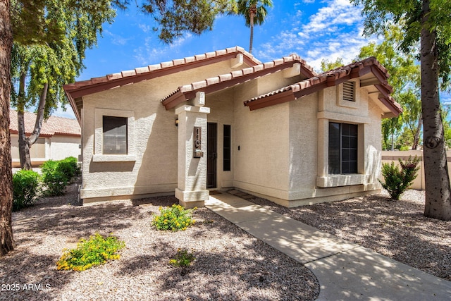 1120 N Val Vista Dr Unit 110, Gilbert, AZ 85234 - view of front of house featuring stucco siding and a tiled roof