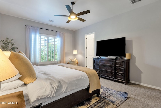 bedroom featuring a ceiling fan, baseboards, visible vents, and light carpet