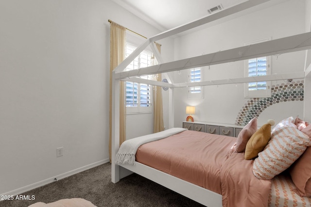 bedroom with visible vents, carpet flooring, and baseboards