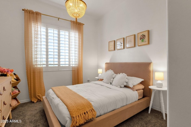 bedroom featuring carpet, a notable chandelier, and multiple windows