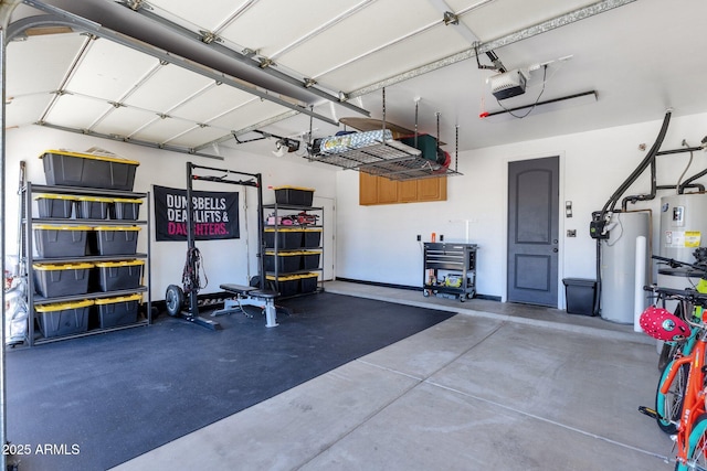 garage featuring water heater and a garage door opener