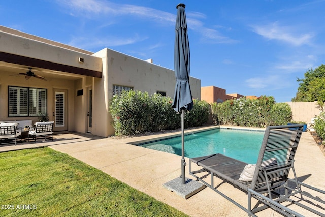 view of pool featuring fence, an outdoor hangout area, ceiling fan, a fenced in pool, and a patio
