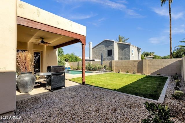 view of yard with a fenced in pool, a fenced backyard, ceiling fan, and a patio area