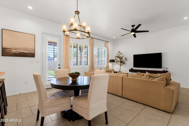 dining room with recessed lighting, baseboards, ceiling fan with notable chandelier, and light tile patterned flooring
