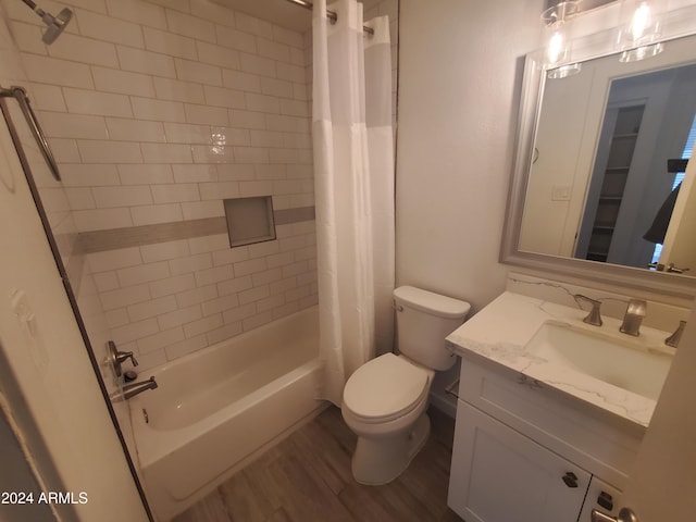 full bathroom featuring toilet, vanity, shower / tub combo, and hardwood / wood-style flooring