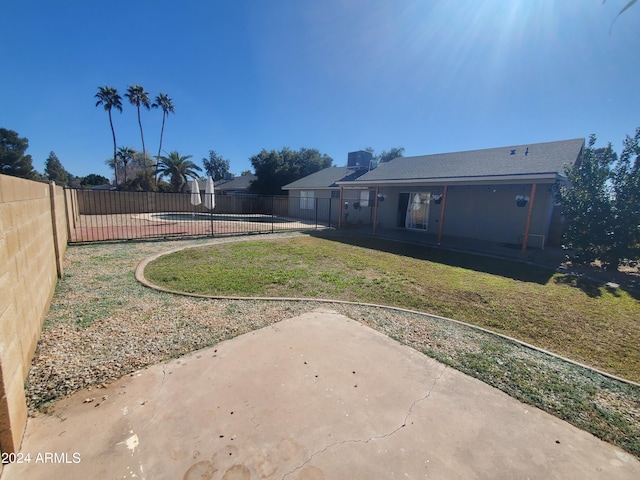 view of yard with a patio and a fenced in pool