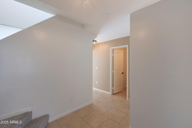 hall with light tile patterned flooring