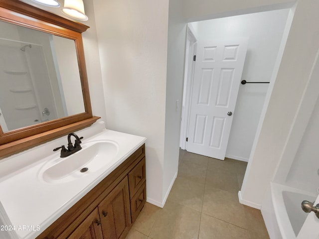 bathroom with shower / bathtub combination, tile patterned flooring, and vanity