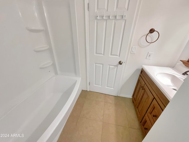 bathroom with tile patterned floors and vanity