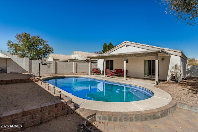 view of swimming pool with a patio area, a fenced backyard, and a fenced in pool