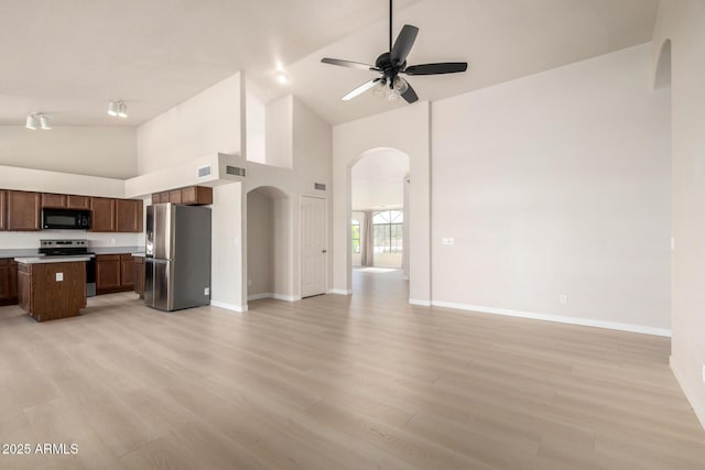 319 N Riata St, Gilbert, AZ 85234 - kitchen featuring stainless steel appliances, open floor plan, arched walkways, a ceiling fan, and high vaulted ceiling