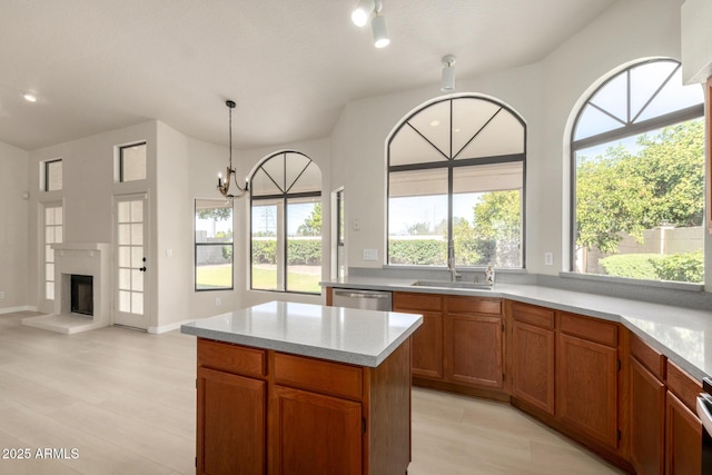 319 N Riata St, Gilbert, AZ 85234 - kitchen with light wood finished floors, a chandelier, a center island, decorative light fixtures, and dishwasher