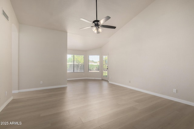 319 N Riata St, Gilbert, AZ 85234 - spare room featuring light wood-style floors, a ceiling fan, and high vaulted ceiling
