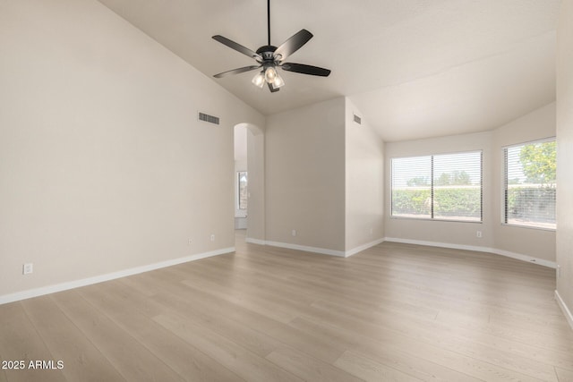 319 N Riata St, Gilbert, AZ 85234 - spare room with light wood-style flooring, arched walkways, a ceiling fan, and high vaulted ceiling
