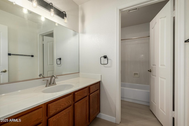 319 N Riata St, Gilbert, AZ 85234 - bathroom with vanity, wood finished floors, and bathtub / shower combination