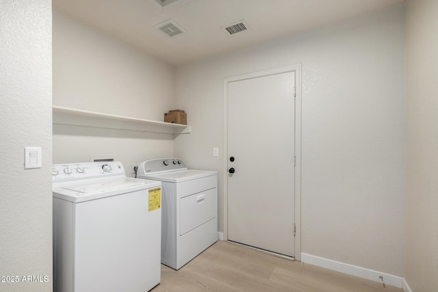 319 N Riata St, Gilbert, AZ 85234 - laundry area with washing machine and clothes dryer and light wood finished floors
