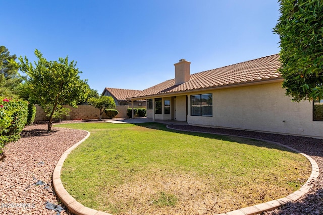319 N Riata St, Gilbert, AZ 85234 - fenced backyard with a patio area