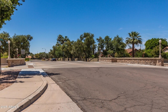 319 N Riata St, Gilbert, AZ 85234 - view of asphalt street featuring street lights, sidewalks, and curbs