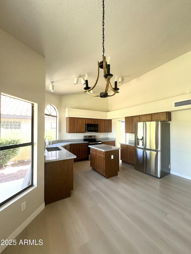 319 N Riata St, Gilbert, AZ 85234 - kitchen featuring stainless steel fridge with ice dispenser, black microwave, a chandelier, electric range, and a textured ceiling