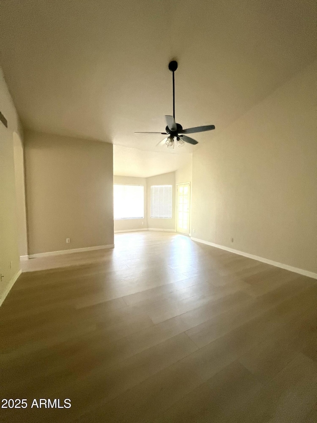319 N Riata St, Gilbert, AZ 85234 - unfurnished room with ceiling fan, wood finished floors, and vaulted ceiling