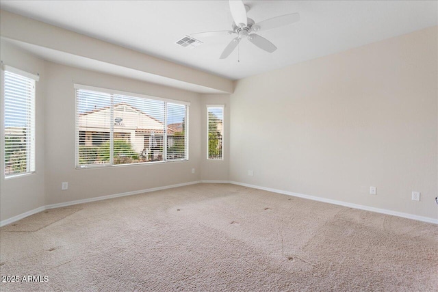 unfurnished room featuring carpet and ceiling fan