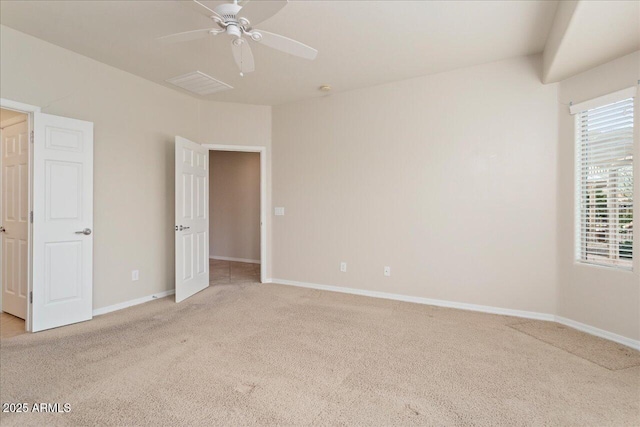 unfurnished bedroom with light colored carpet and ceiling fan