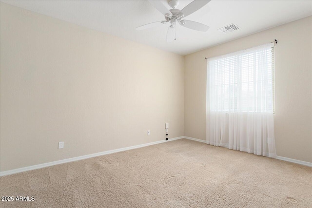 spare room with carpet flooring and ceiling fan