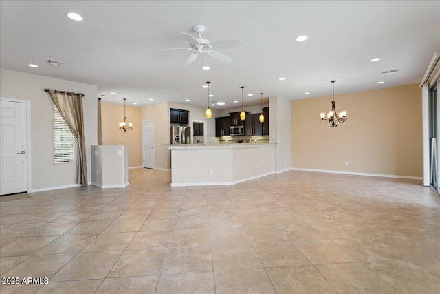 unfurnished living room with light tile patterned floors and ceiling fan with notable chandelier