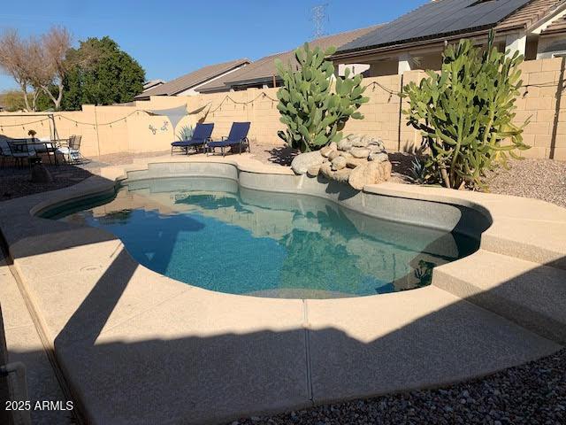 view of swimming pool with a patio