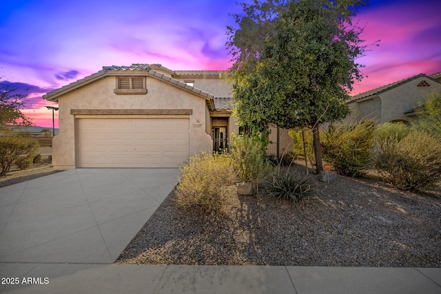 view of front of home with a garage