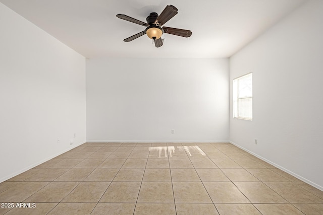 tiled empty room with ceiling fan