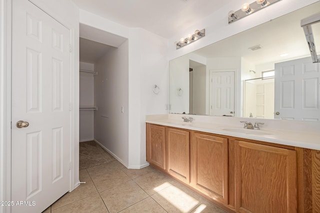 bathroom featuring tile patterned floors and vanity