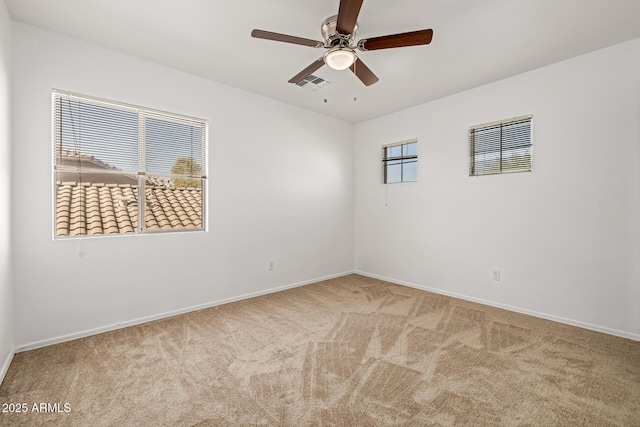 carpeted empty room with ceiling fan