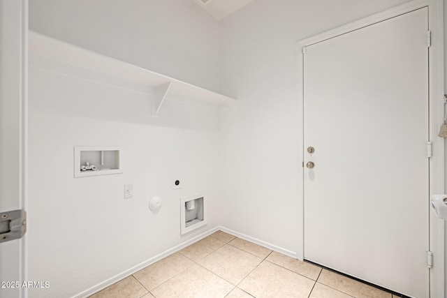 clothes washing area with gas dryer hookup, hookup for an electric dryer, hookup for a washing machine, and light tile patterned floors