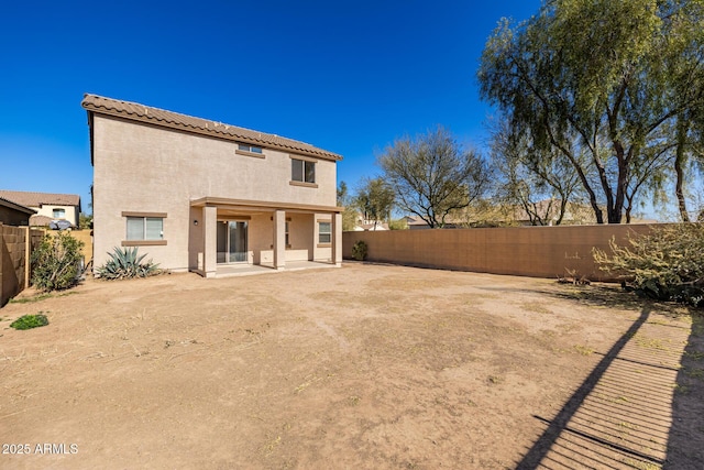 back of property featuring a patio area