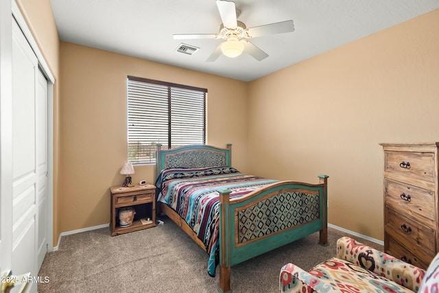 bedroom featuring ceiling fan, light colored carpet, and a closet