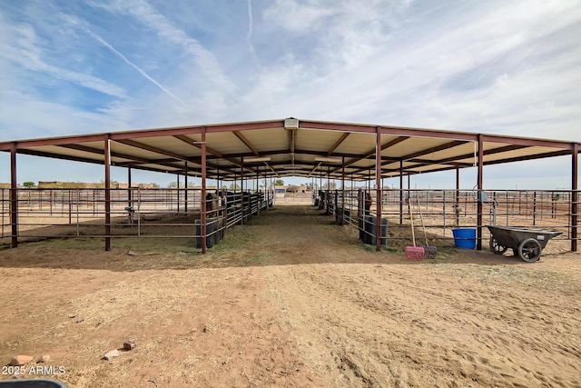 view of stable with a rural view