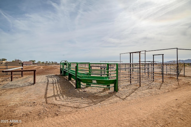 surrounding community featuring a rural view and an outbuilding