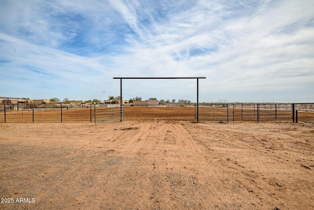 view of yard with a rural view