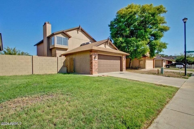 view of front facade with a front yard and a garage