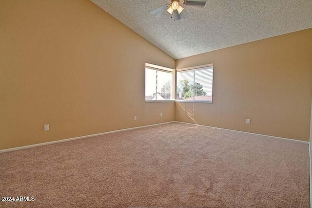 unfurnished room with carpet flooring, a textured ceiling, ceiling fan, and lofted ceiling