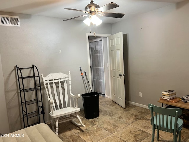 sitting room featuring ceiling fan