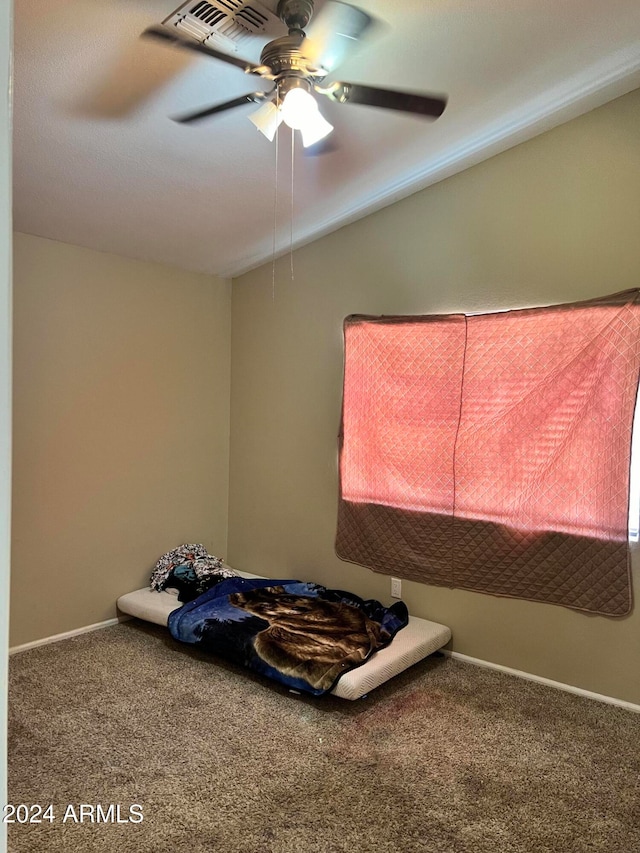 unfurnished bedroom with carpet flooring and ceiling fan