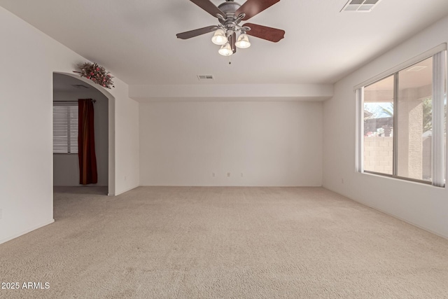 carpeted empty room featuring ceiling fan